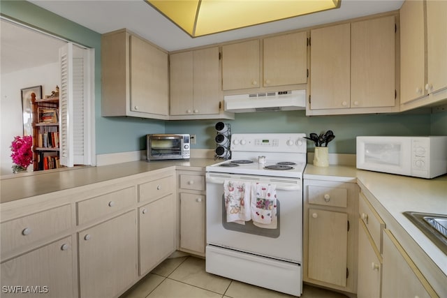 kitchen with light brown cabinetry, light tile patterned floors, and white appliances