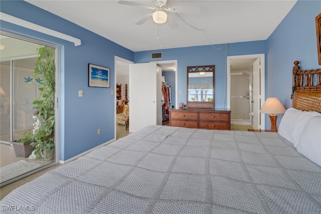 bedroom featuring access to outside, ceiling fan, and ensuite bathroom