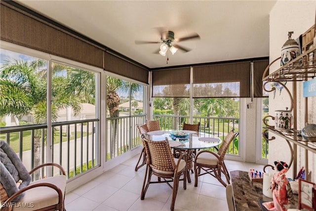 sunroom featuring ceiling fan and a healthy amount of sunlight