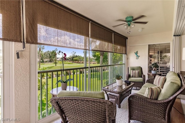 sunroom / solarium featuring ceiling fan