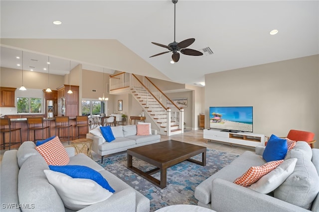 living room featuring ceiling fan, hardwood / wood-style floors, and high vaulted ceiling