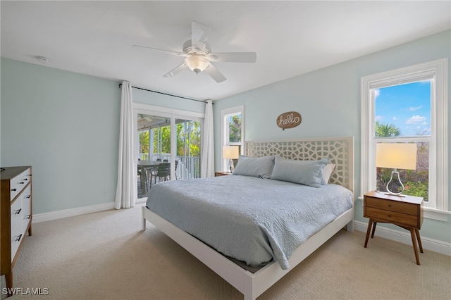 carpeted bedroom with ceiling fan and access to exterior