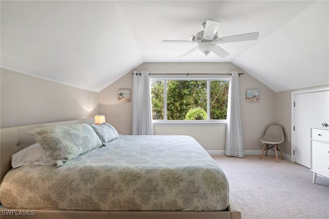 carpeted bedroom featuring lofted ceiling and ceiling fan