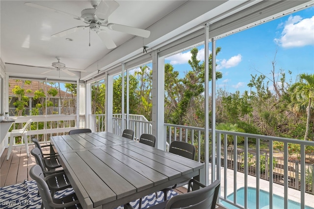 sunroom / solarium with ceiling fan