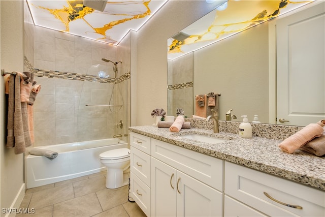 full bathroom with vanity, tiled shower / bath combo, toilet, and tile patterned floors