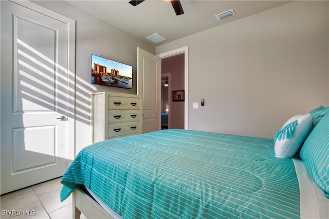 bedroom featuring light tile patterned flooring and ceiling fan