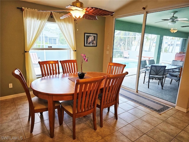 dining area featuring ceiling fan and light tile patterned floors