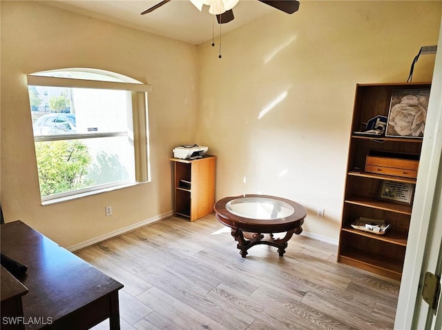 sitting room with light hardwood / wood-style floors and ceiling fan