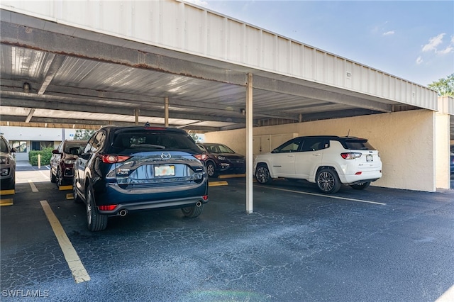 view of parking / parking lot with a carport