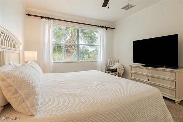 bedroom with ceiling fan, carpet flooring, and crown molding