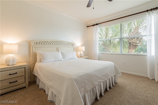 carpeted bedroom with crown molding and ceiling fan