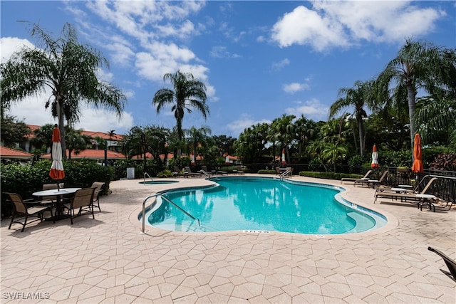 view of swimming pool featuring a patio