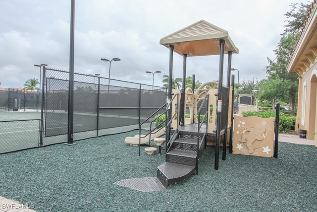 view of playground featuring tennis court