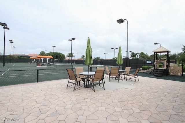 view of patio with tennis court