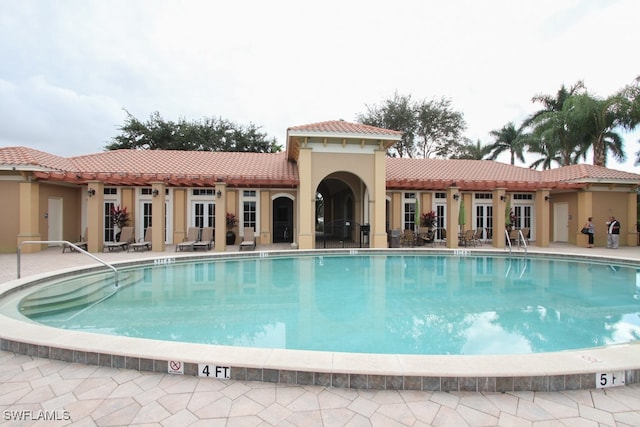 view of pool featuring a patio