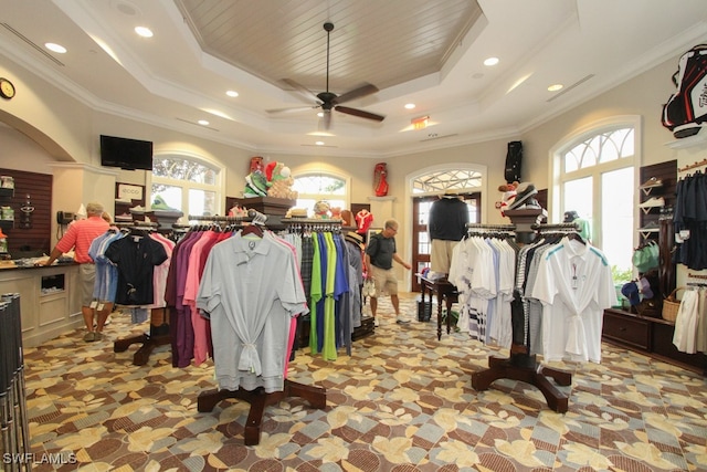 spacious closet featuring ceiling fan and a raised ceiling