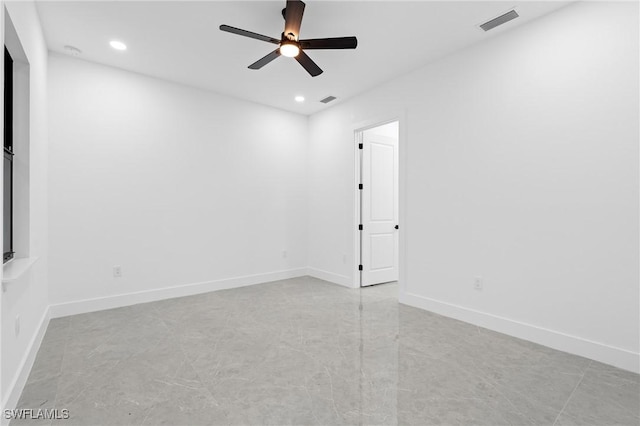 spare room with ceiling fan