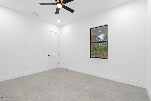 spare room with ceiling fan