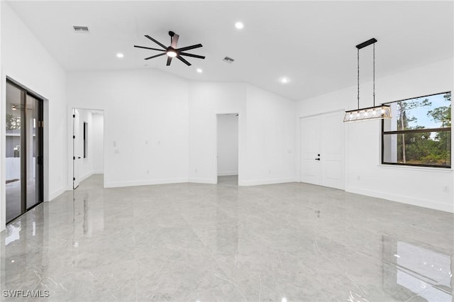 unfurnished living room with ceiling fan and lofted ceiling