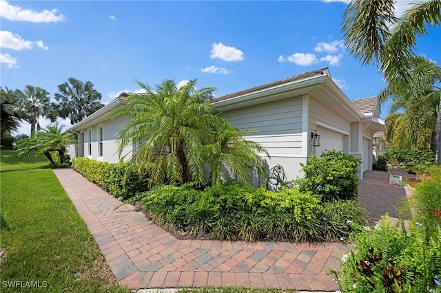 view of side of property with a garage