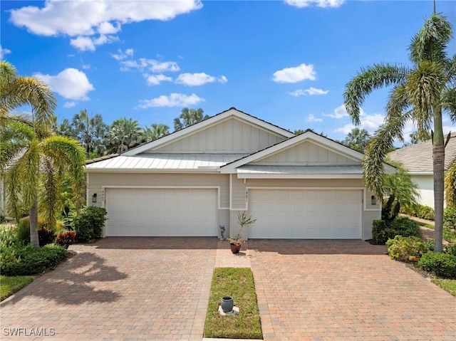 single story home featuring a garage