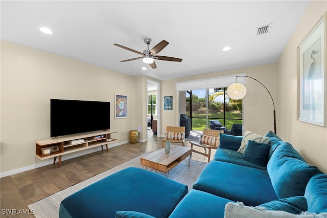 living room with hardwood / wood-style flooring and ceiling fan