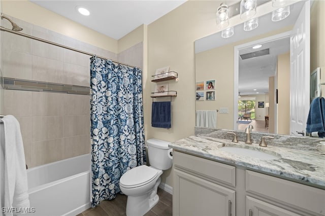 full bathroom with vanity, toilet, and shower / bath combo with shower curtain