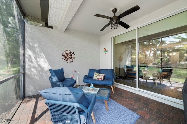 sunroom / solarium with ceiling fan