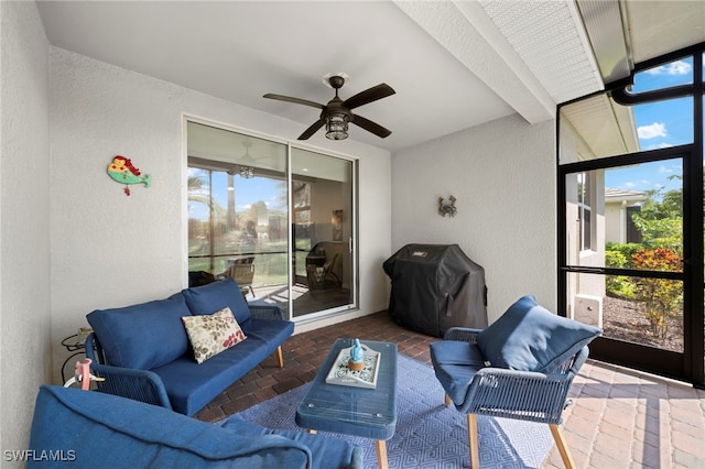 view of patio featuring a grill and ceiling fan