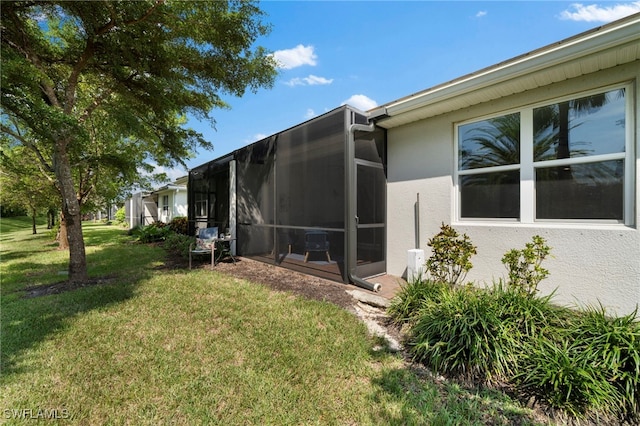 view of side of property with a yard