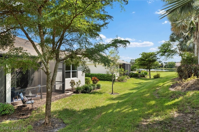 view of yard with glass enclosure