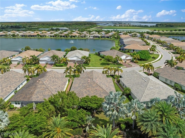 birds eye view of property with a water view