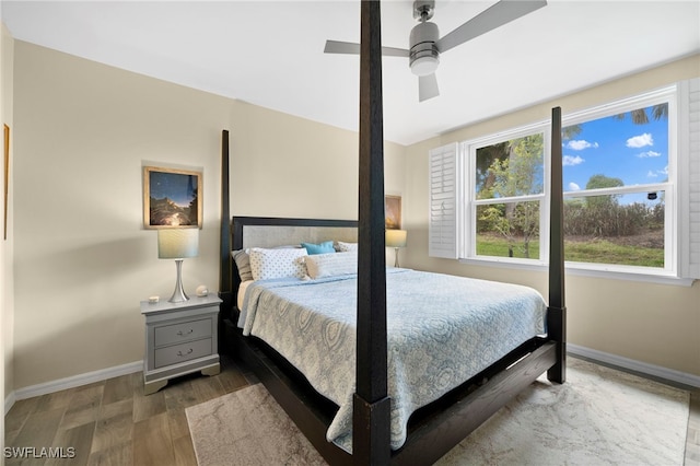 bedroom featuring dark hardwood / wood-style floors and ceiling fan