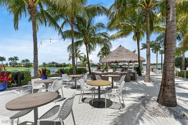 view of patio / terrace featuring a gazebo and a water view