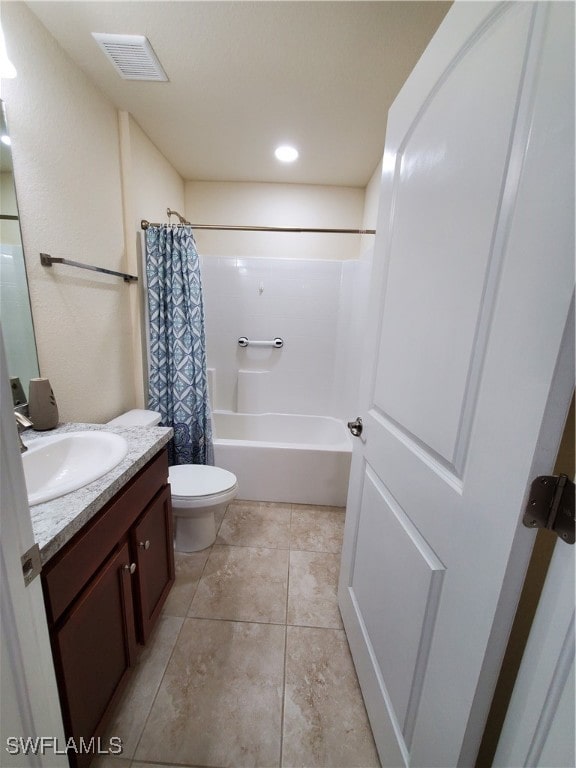 full bathroom featuring shower / tub combo, tile patterned flooring, vanity, and toilet