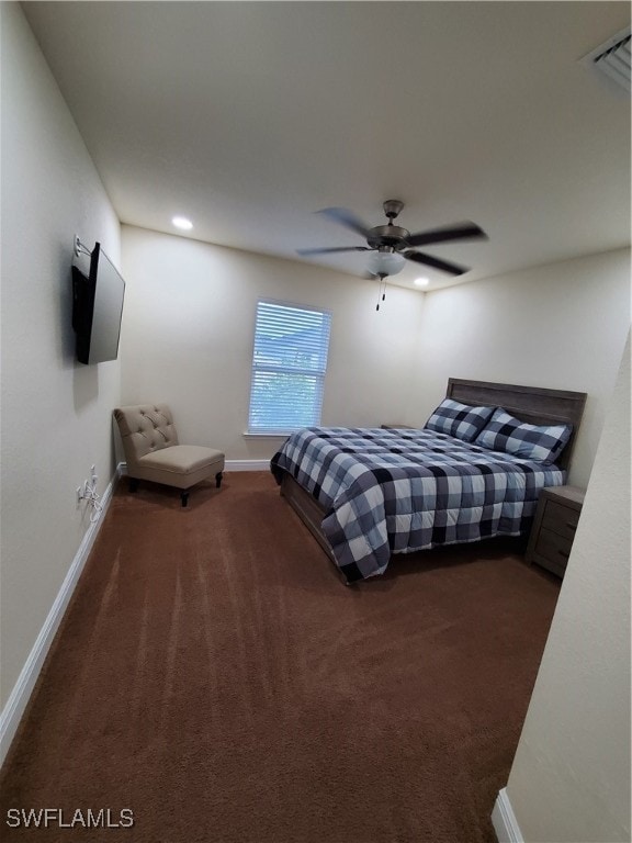 bedroom featuring ceiling fan and dark colored carpet