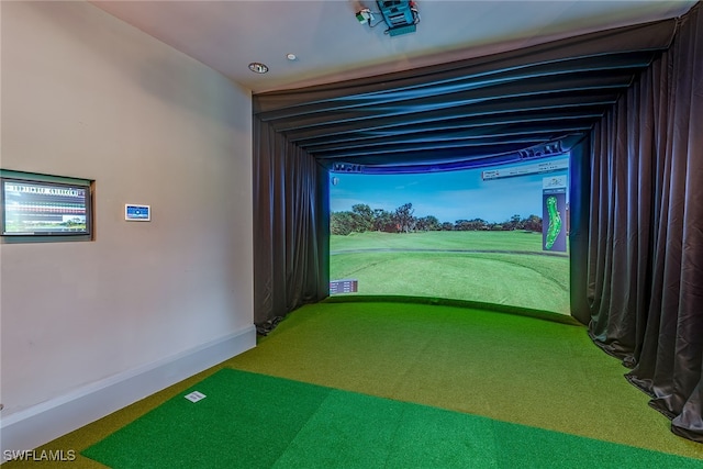 game room with carpet flooring and golf simulator