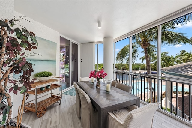 sunroom with a water view