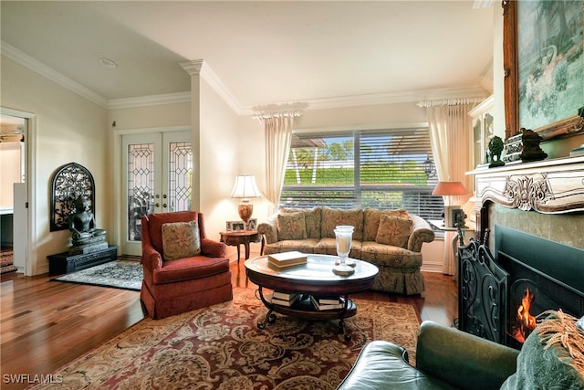 living room with ornamental molding and light wood-type flooring