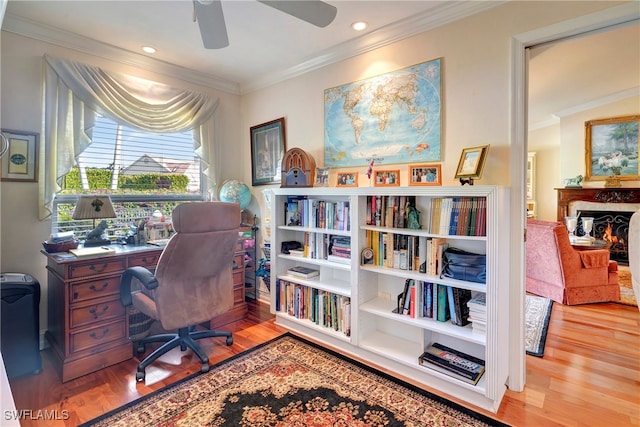 office space with light hardwood / wood-style flooring, ceiling fan, and crown molding