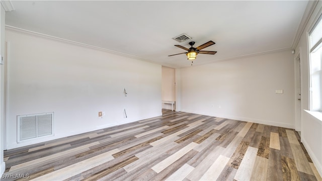 empty room featuring light hardwood / wood-style flooring, ceiling fan, and ornamental molding