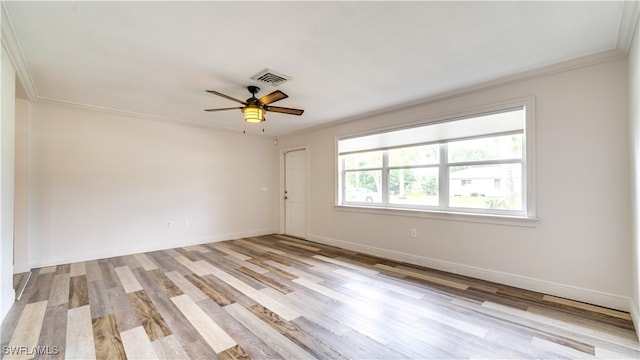 spare room with crown molding, ceiling fan, and light hardwood / wood-style flooring