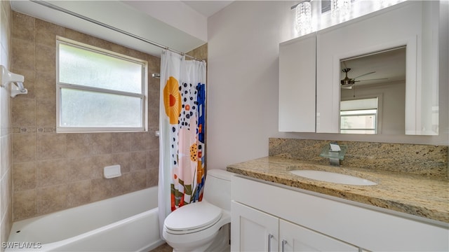 full bathroom with ceiling fan, vanity, toilet, and shower / bathtub combination with curtain