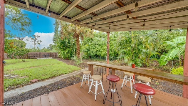 wooden terrace with a lawn