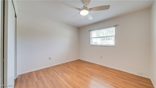 empty room with light hardwood / wood-style floors and ceiling fan