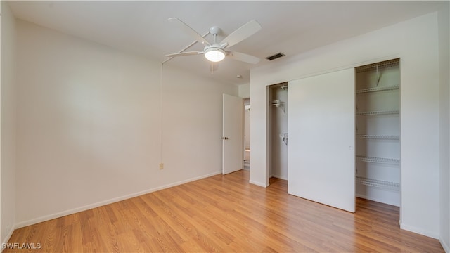 unfurnished bedroom with ceiling fan and light hardwood / wood-style flooring