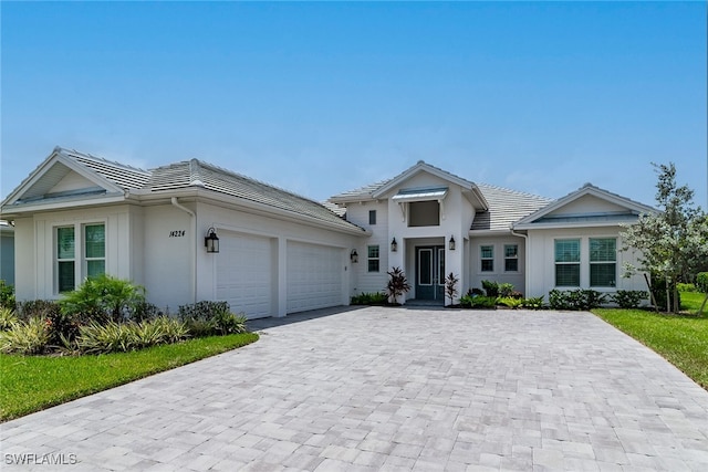 view of front of property with a garage