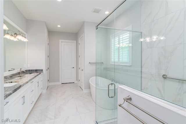 bathroom featuring vanity and separate shower and tub