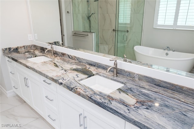 bathroom featuring vanity and shower with separate bathtub