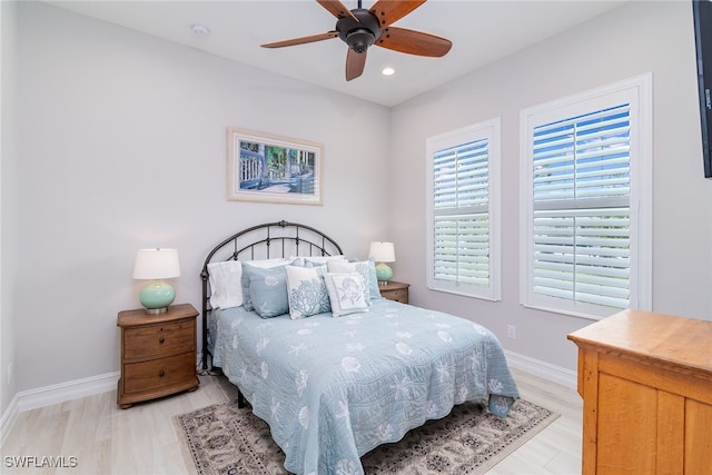 bedroom with light wood-type flooring and ceiling fan